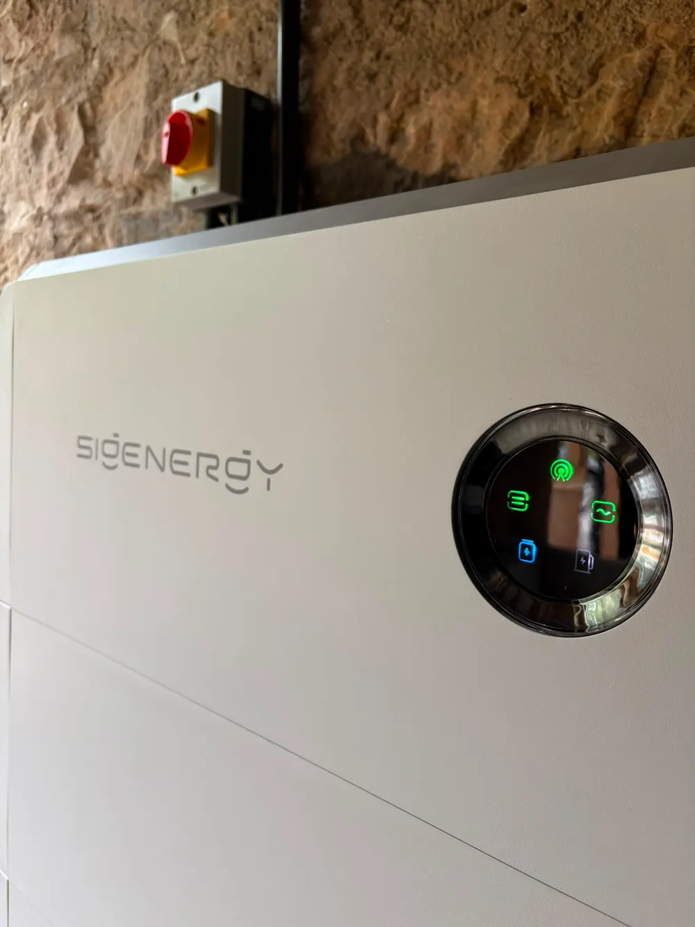 Sigenergy battery storage unit with its status ring showing the system running