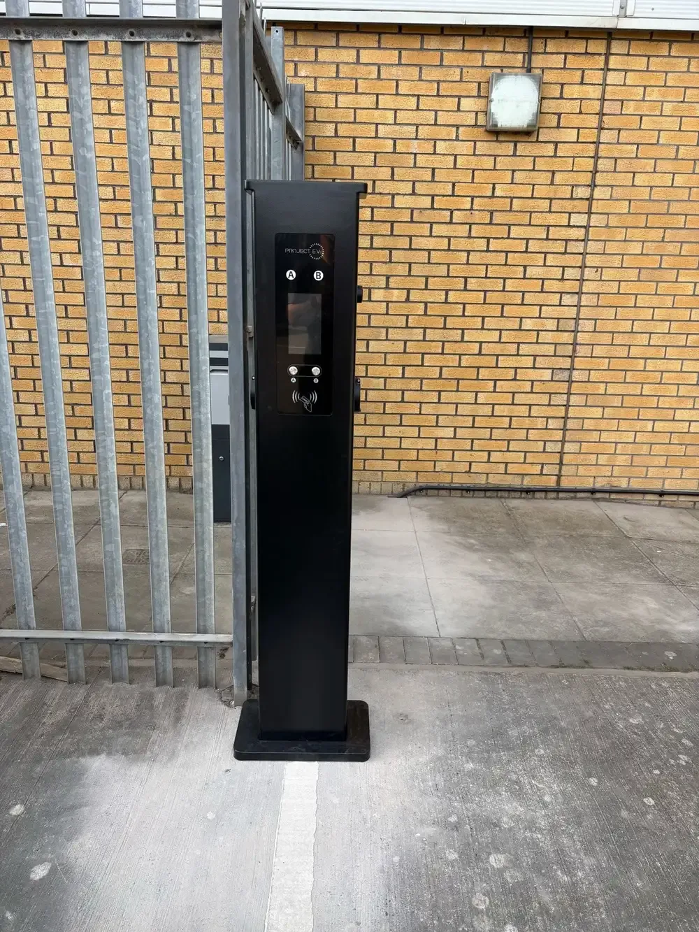 Dual-socket EV charging pedestal installed at a commercial site in Edinburgh